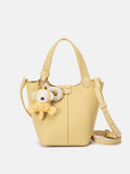 PAZZION, Haley Leather Charmed Bucket Bag, Yellow